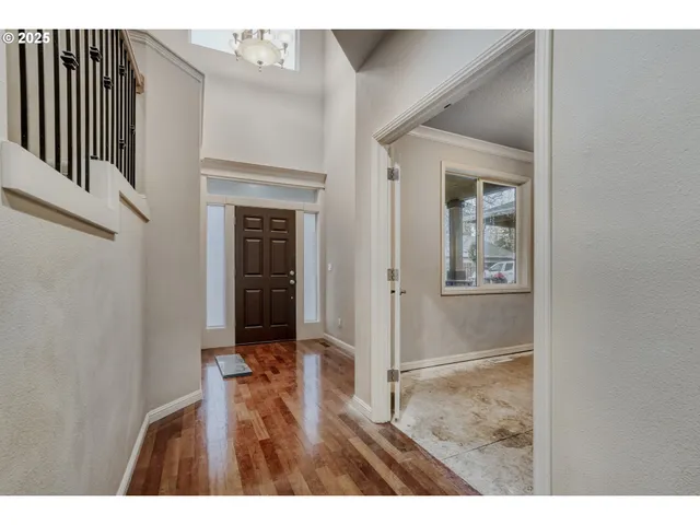 a view of entryway with wooden floor