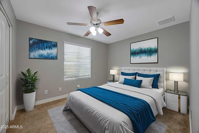 a bedroom with a large bed and a window