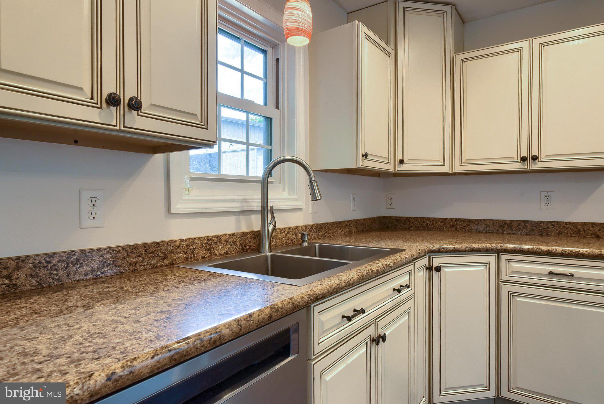 3740 Beagle Road Middletown, PA 17057 - Photo 9 of 70 a kitchen with granite countertop a sink and white cabinets