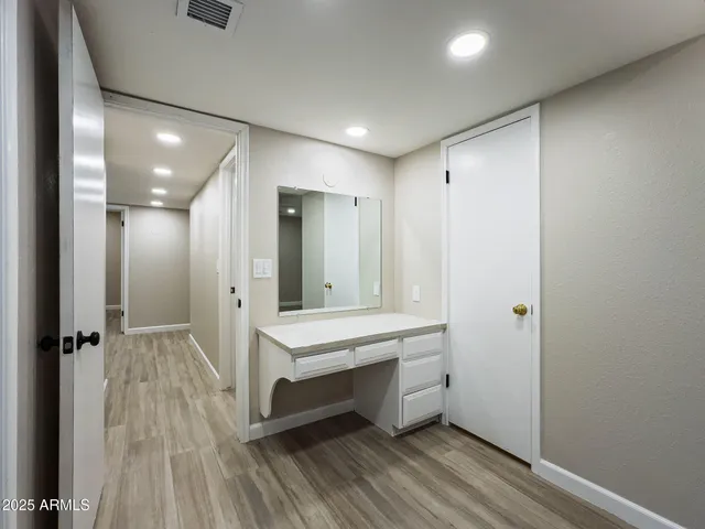 a large bathroom with a double vanity sink and mirror