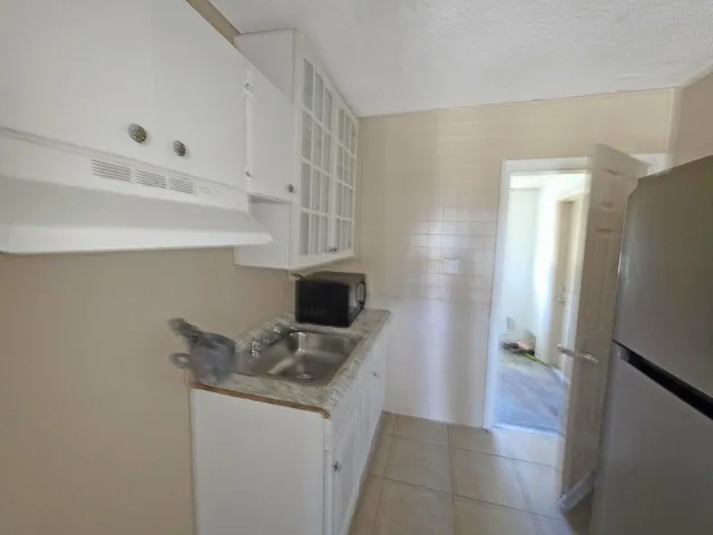 a kitchen with appliances and cabinets