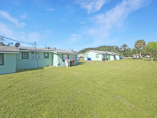 a view of a house with outdoor space and sitting area