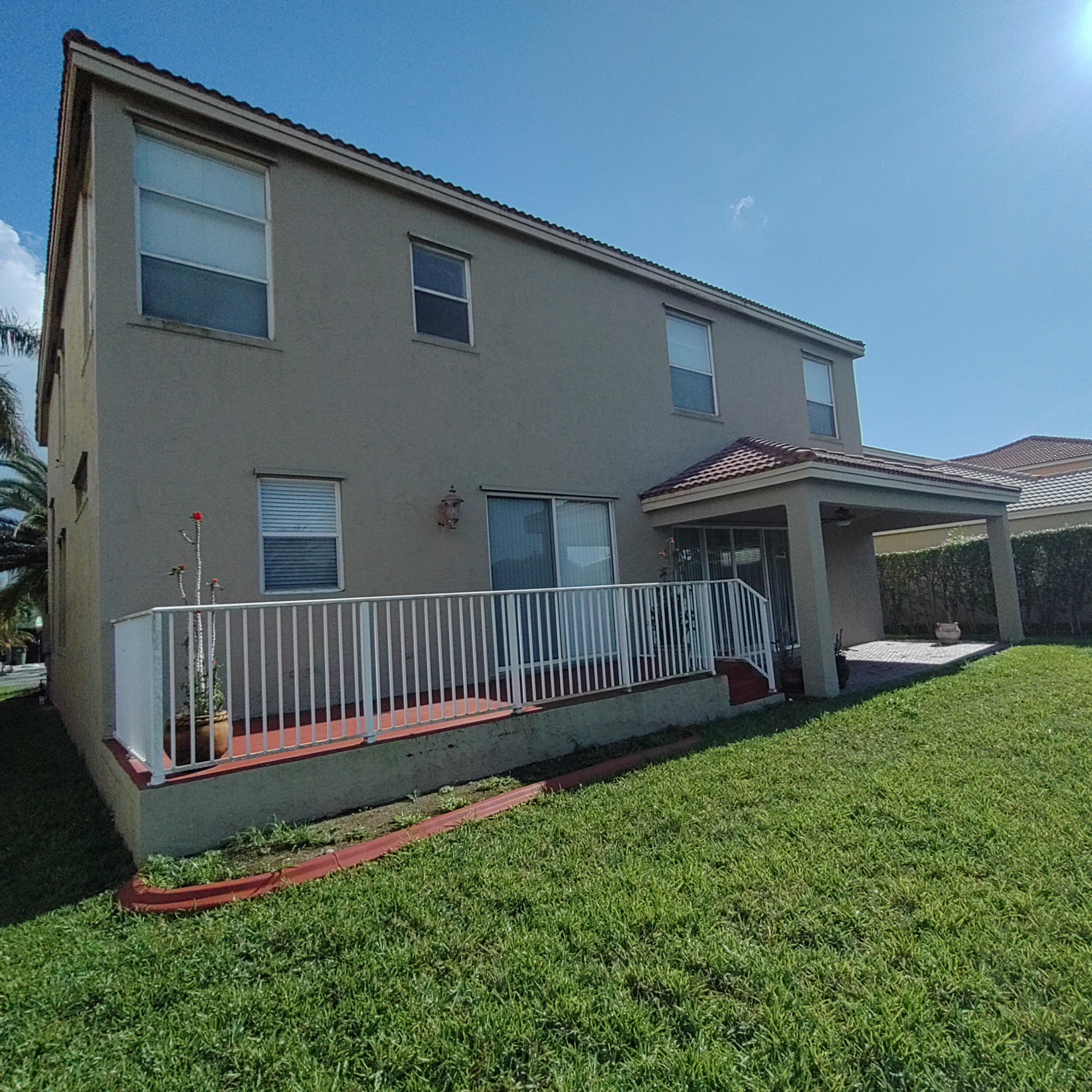 16729 Southwest 16th Street Pembroke Pines, FL 33027 - Photo 2 of 6 a view of a house with a yard and deck