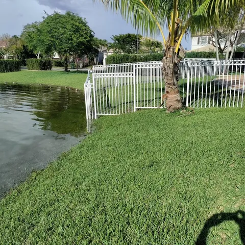 a view of a garden with a lake view