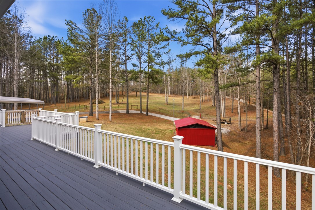 196 Flyroot Trail Pickens, SC 29671 - Photo 4 of 48 This tranquil setting offers sweeping views of mature trees and expansive grounds from a private deck.