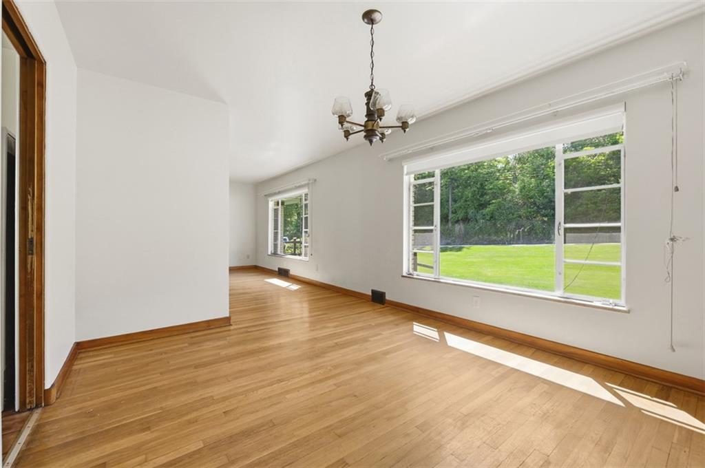 524 McElheny Road Glenshaw, PA 15116 - Photo 11 of 41 a view of a room with wooden floor and windows