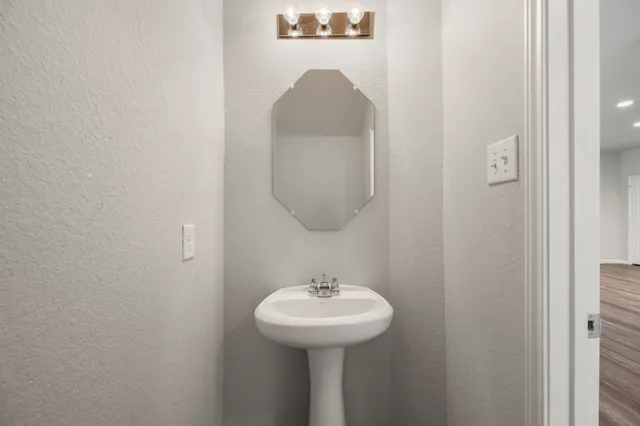 a bathroom with a sink a toilet and a bathtub