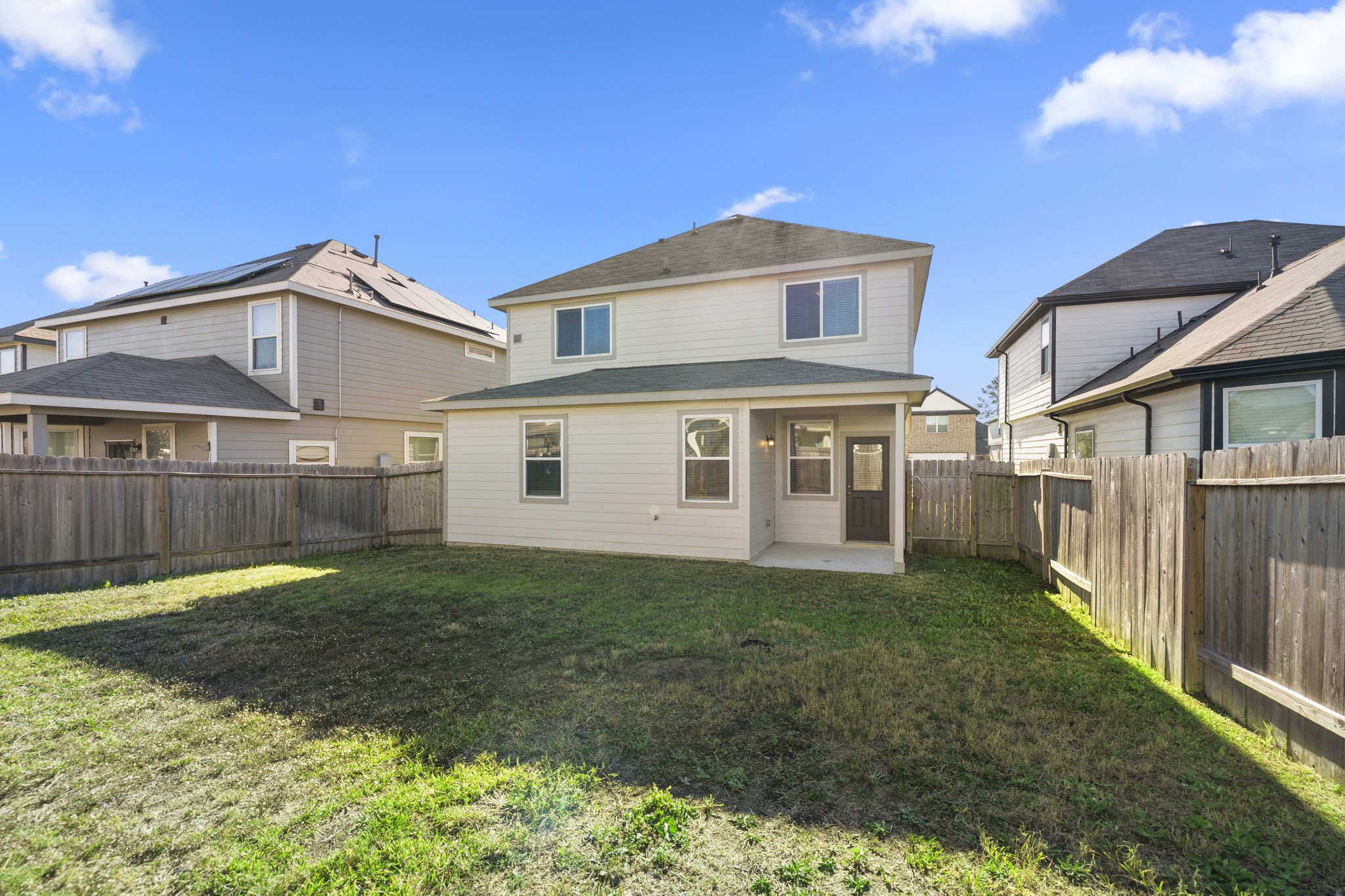 3571 Cannon Drive Conroe, TX 77301 - Photo 27 of 39 Outside, a fenced backyard w/ a covered patio is perfect for outdoor dining & quiet relaxation.
