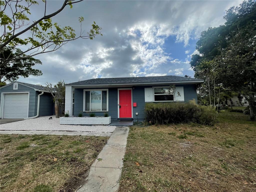 250 37th Street North St. Petersburg, FL 33713 - Photo 1 of 16 a front view of a house with a yard and potted plants