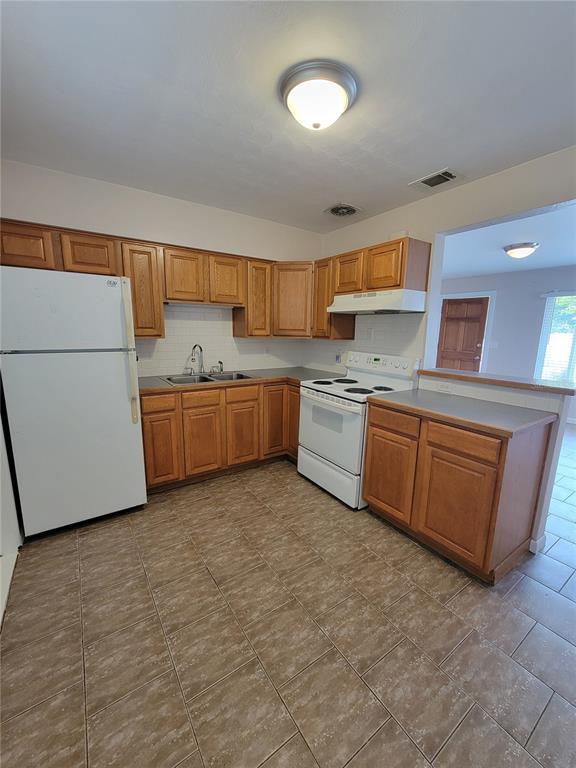 250 37th Street North St. Petersburg, FL 33713 - Photo 12 of 16 a kitchen with stainless steel appliances granite countertop a stove and a sink