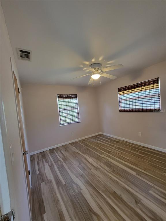 250 37th Street North St. Petersburg, FL 33713 - Photo 5 of 16 a view of an empty room with wooden floor and a window