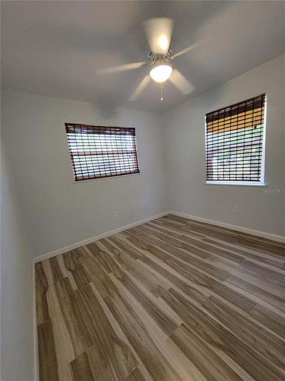 250 37th Street North St. Petersburg, FL 33713 - Photo 9 of 16 a view of a room with wooden floor and chandelier fan