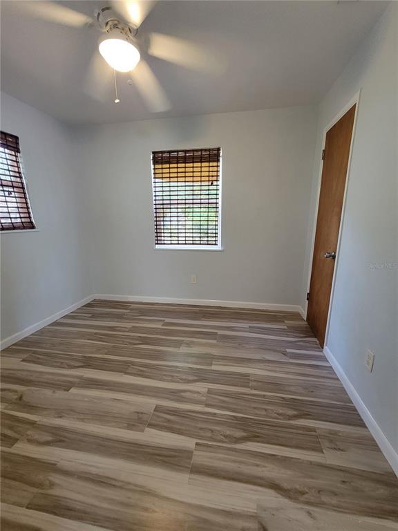 250 37th Street North St. Petersburg, FL 33713 - Photo 10 of 16 a view of empty room with wooden floor and fan