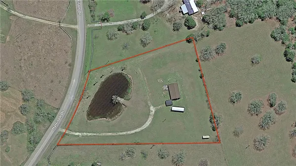 an aerial view of a highlighted house