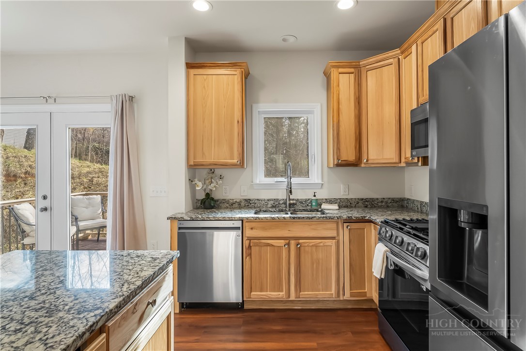 262 Old Bristol Road Boone, NC 28607 - Photo 4 of 26 a kitchen with stainless steel appliances granite countertop a stove a sink and a microwave
