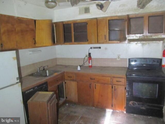 215 Andrew Road Coatesville, PA 19320 - Photo 5 of 8 a kitchen with a sink and cabinets