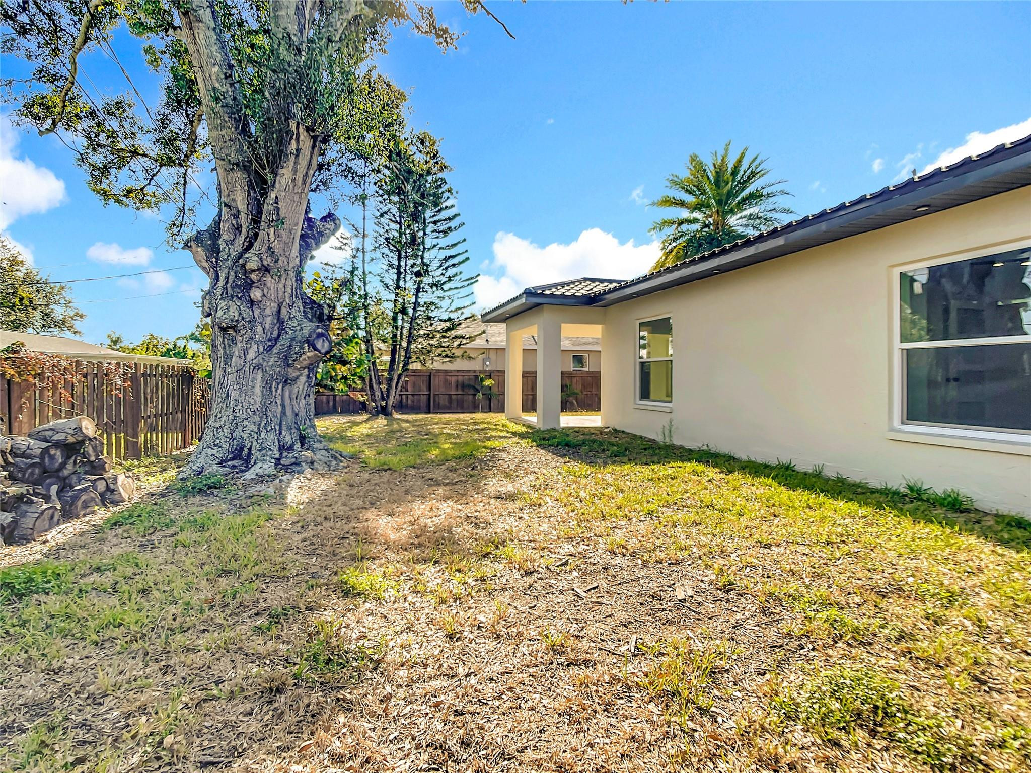 2565 Englewood Road Venice, FL 34293 - Photo 15 of 19 a house with trees in front of it