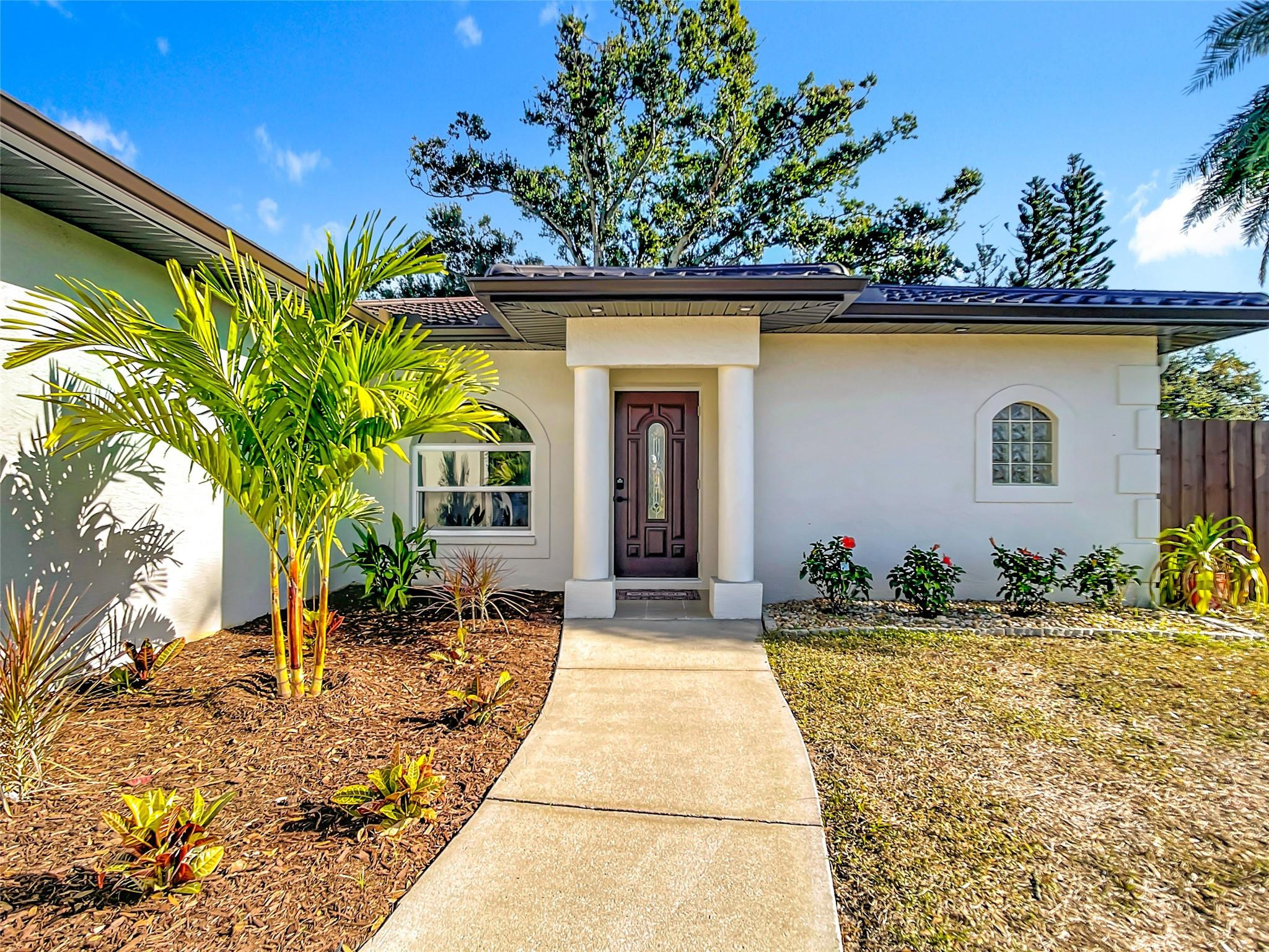2565 Englewood Road Venice, FL 34293 - Photo 17 of 19 a front view of a house with a yard