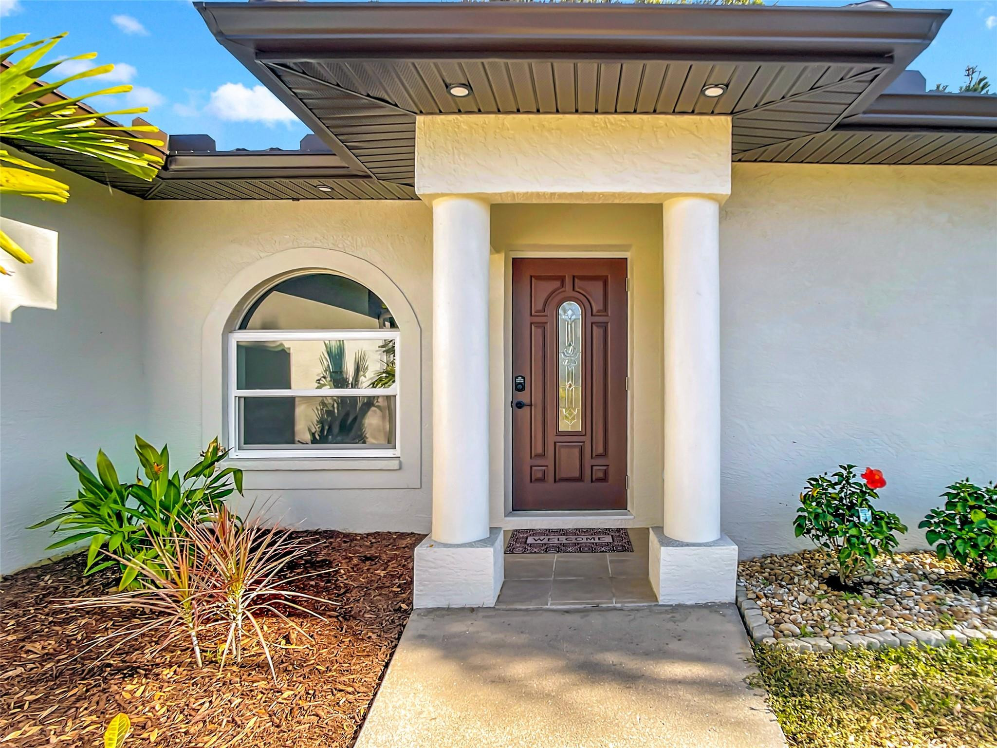 2565 Englewood Road Venice, FL 34293 - Photo 18 of 19 a front view of a house with a porch