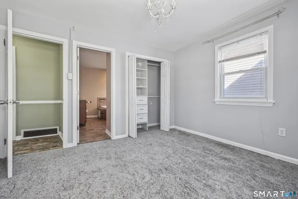a bathroom with a sink mirror and shower