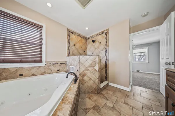 a bathroom with a sink mirror vanity and toilet