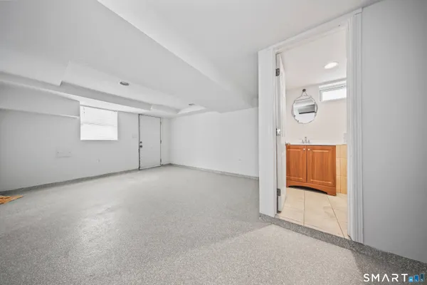 a view of a patio with a table and chairs