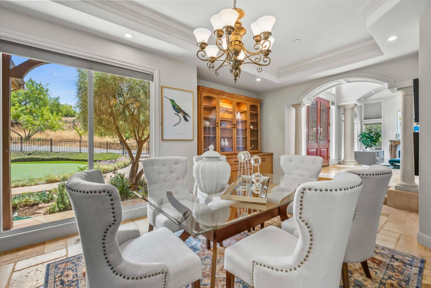 2390 Rockwood Ranch Road Morgan Hill, CA 95037 - Photo 15 of 92 a view of a dining room with furniture a chandelier and large windows