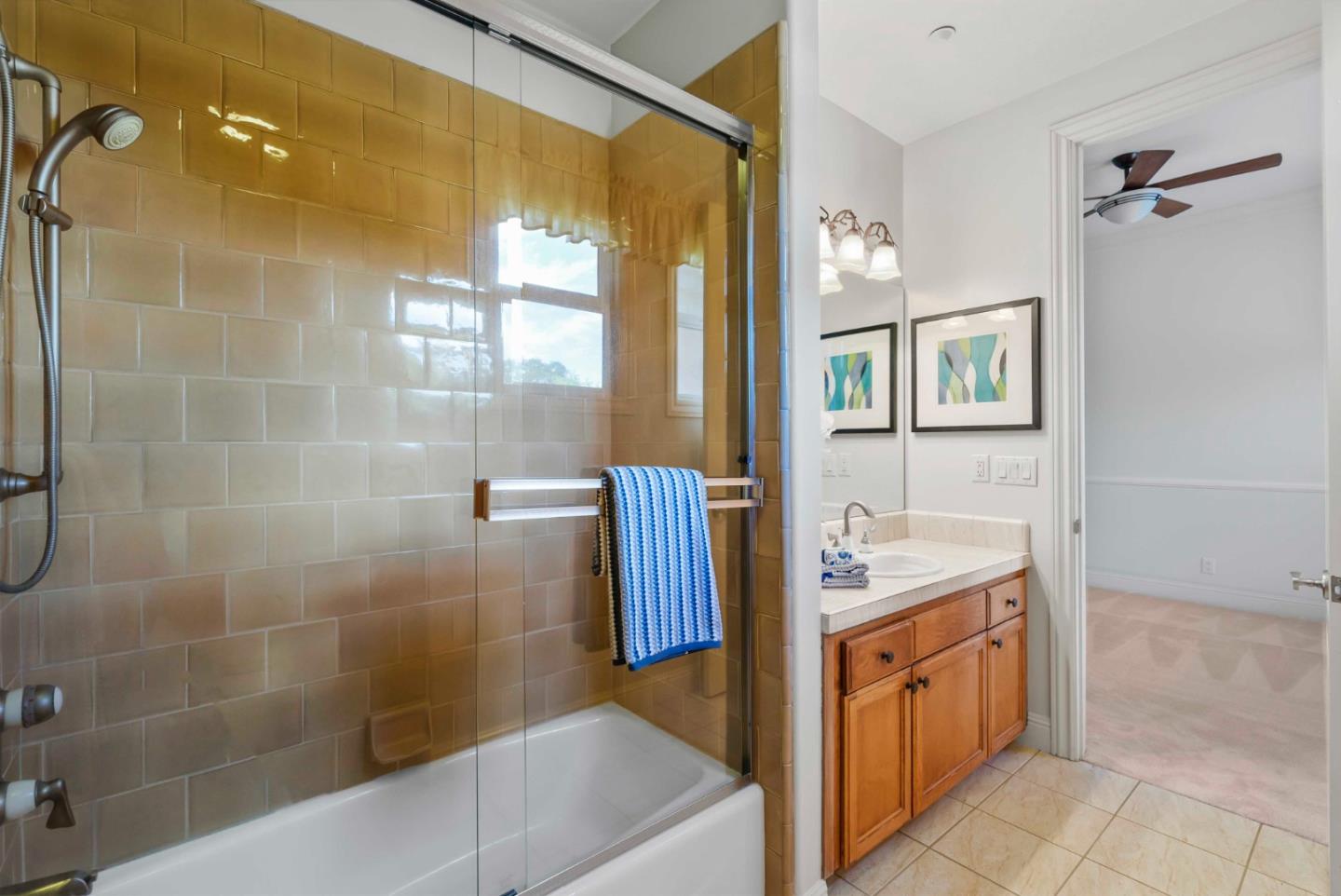 2390 Rockwood Ranch Road Morgan Hill, CA 95037 - Photo 57 of 92 a spacious bathroom with a granite countertop sink a mirror and a bathtub