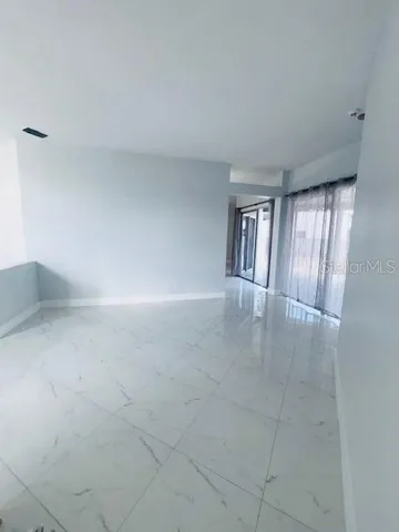 a view of an empty room and window