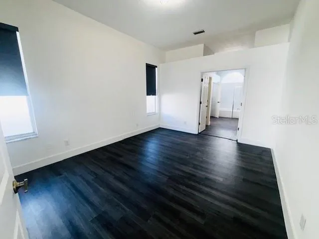 a view of a livingroom with wooden floor