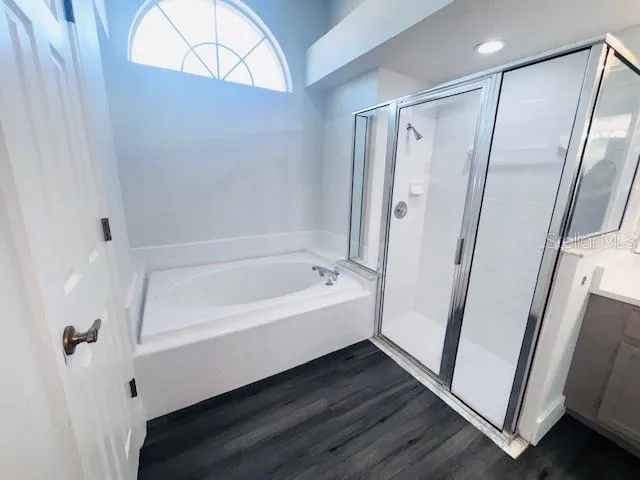 a bathroom with a bathtub and a shower