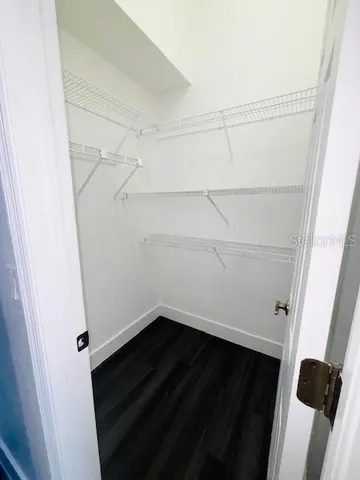 an empty room with wooden floor