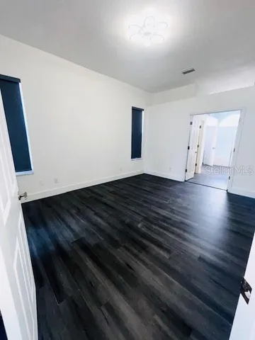 a bathroom with a sink a toilet a mirror and vanity