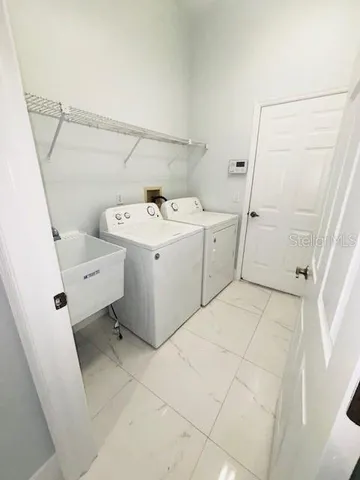a utility room with dryer and washer