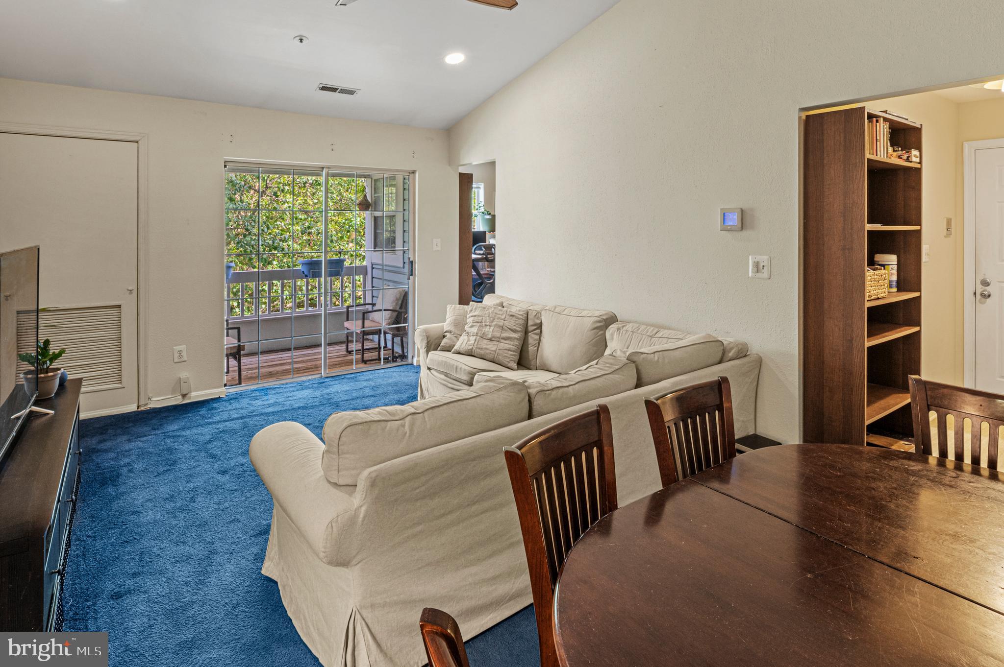 8559 Falls Run Road, Unit L Ellicott City, MD 21043 - Photo 11 of 28 a living room with furniture and a wooden floor