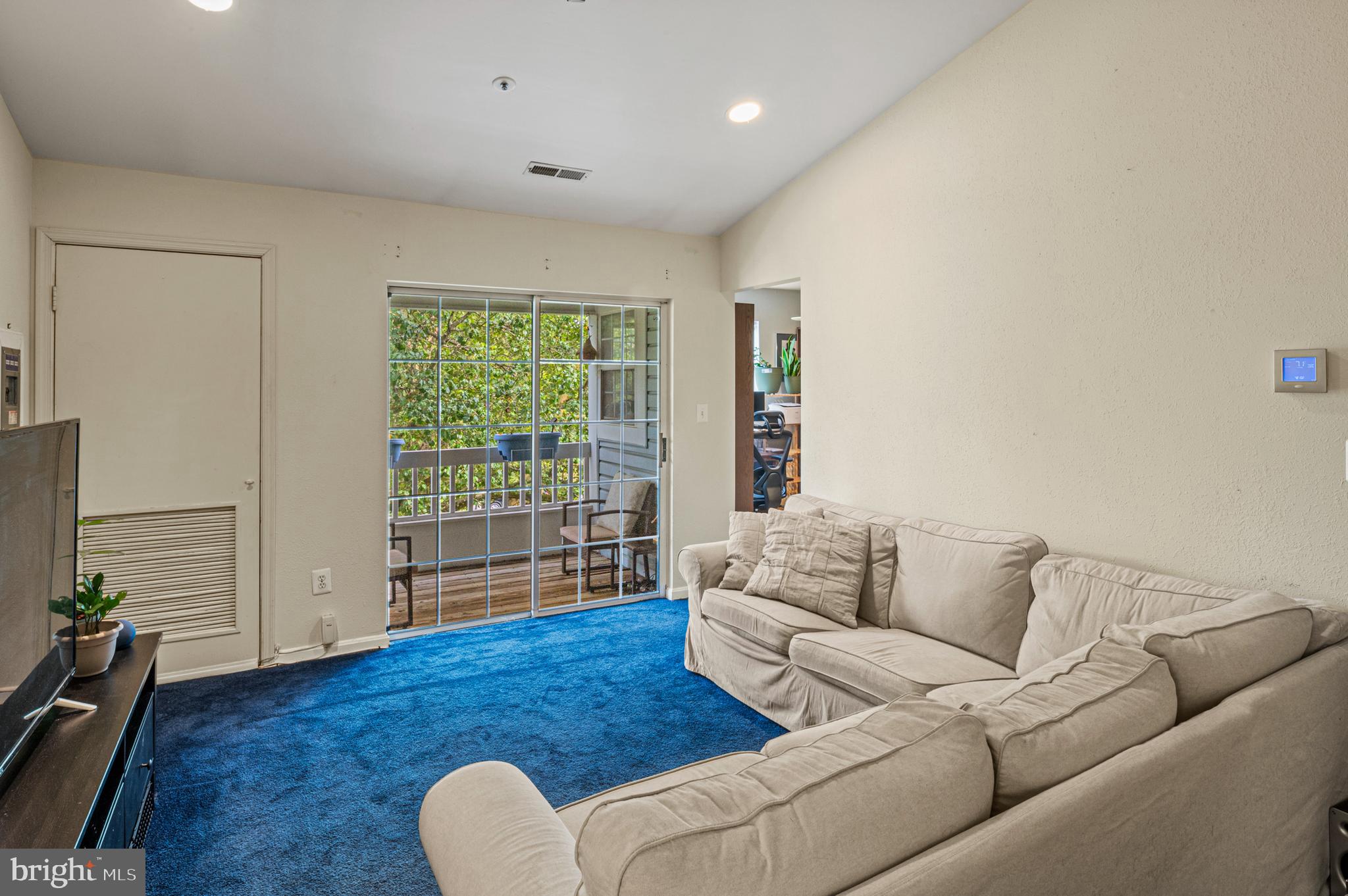 8559 Falls Run Road, Unit L Ellicott City, MD 21043 - Photo 12 of 28 a living room with furniture and a wooden floor