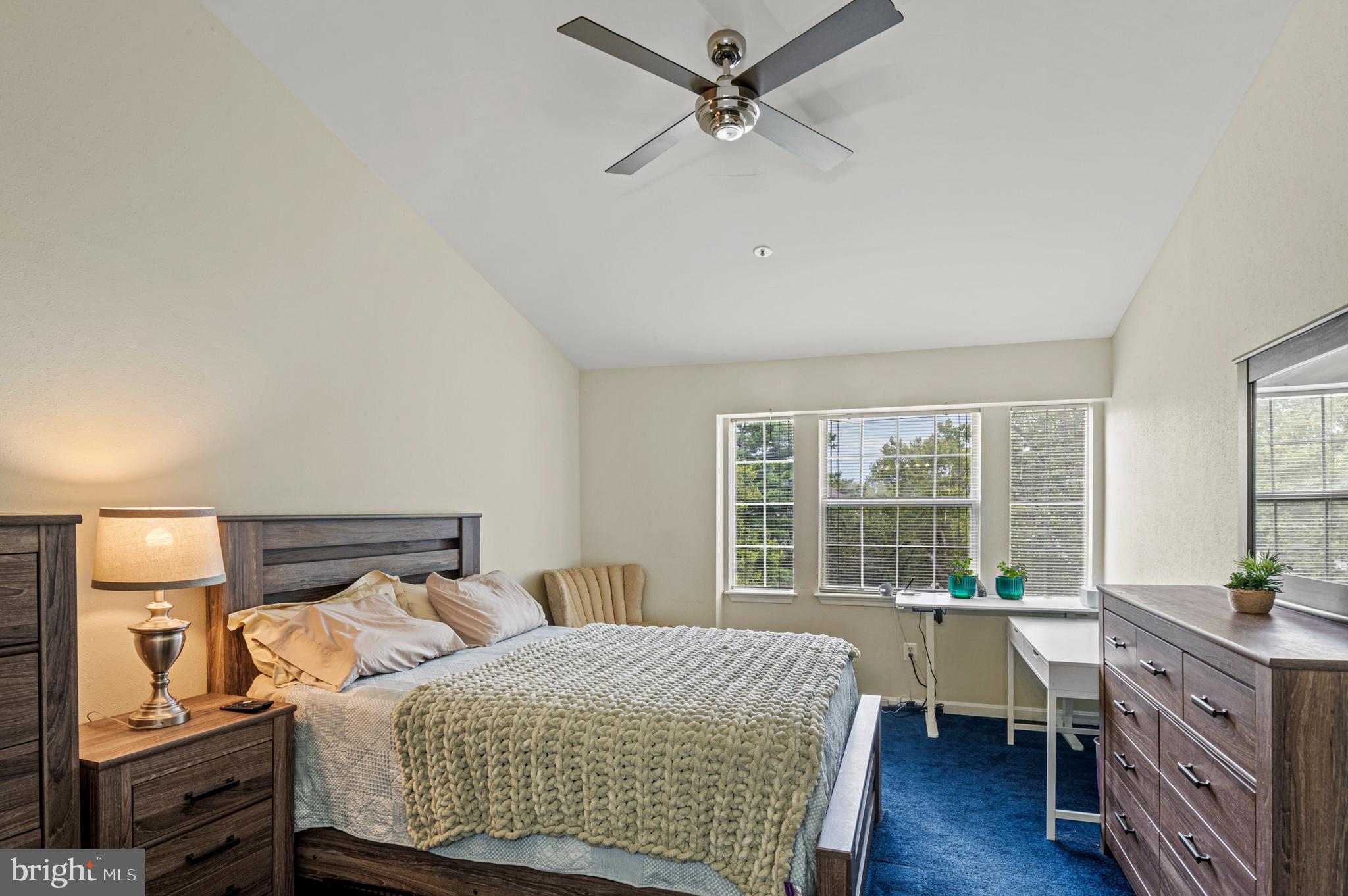 8559 Falls Run Road, Unit L Ellicott City, MD 21043 - Photo 15 of 28 a bedroom with a bed and a large window with wooden floor