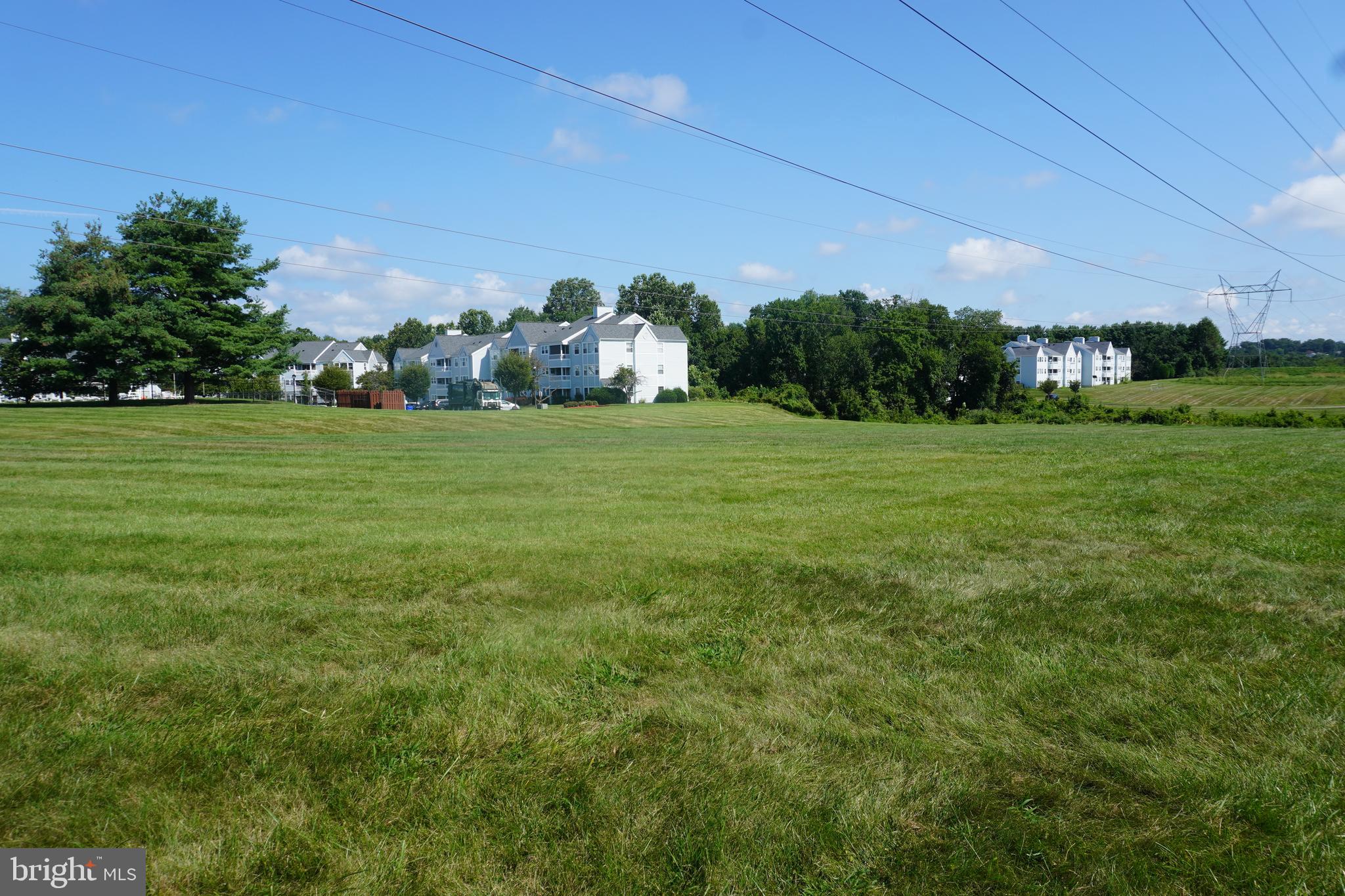 8559 Falls Run Road, Unit L Ellicott City, MD 21043 - Photo 23 of 28 a front view of a house with a garden