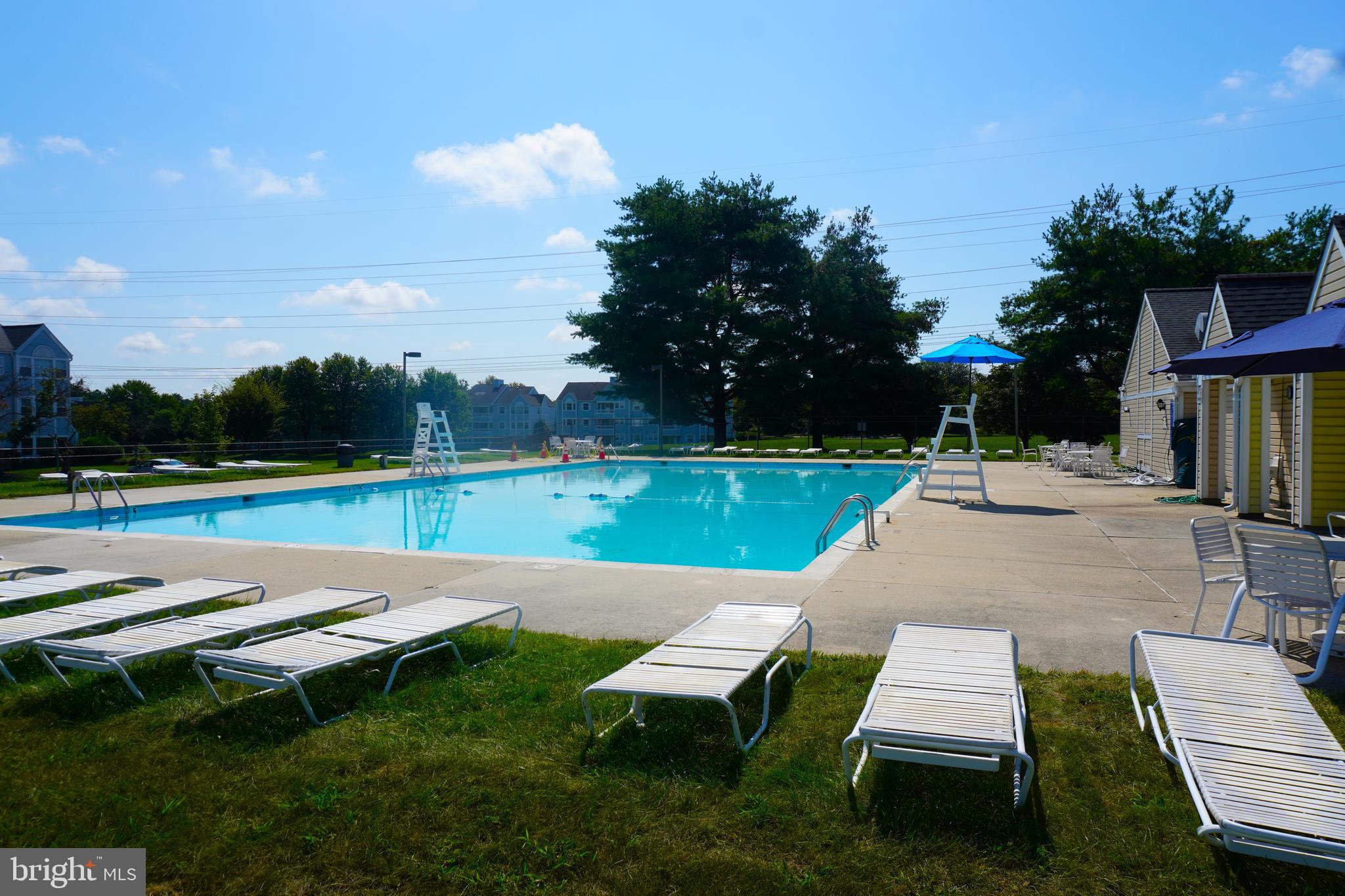 8559 Falls Run Road, Unit L Ellicott City, MD 21043 - Photo 24 of 28 a view of yard with seating area and slide