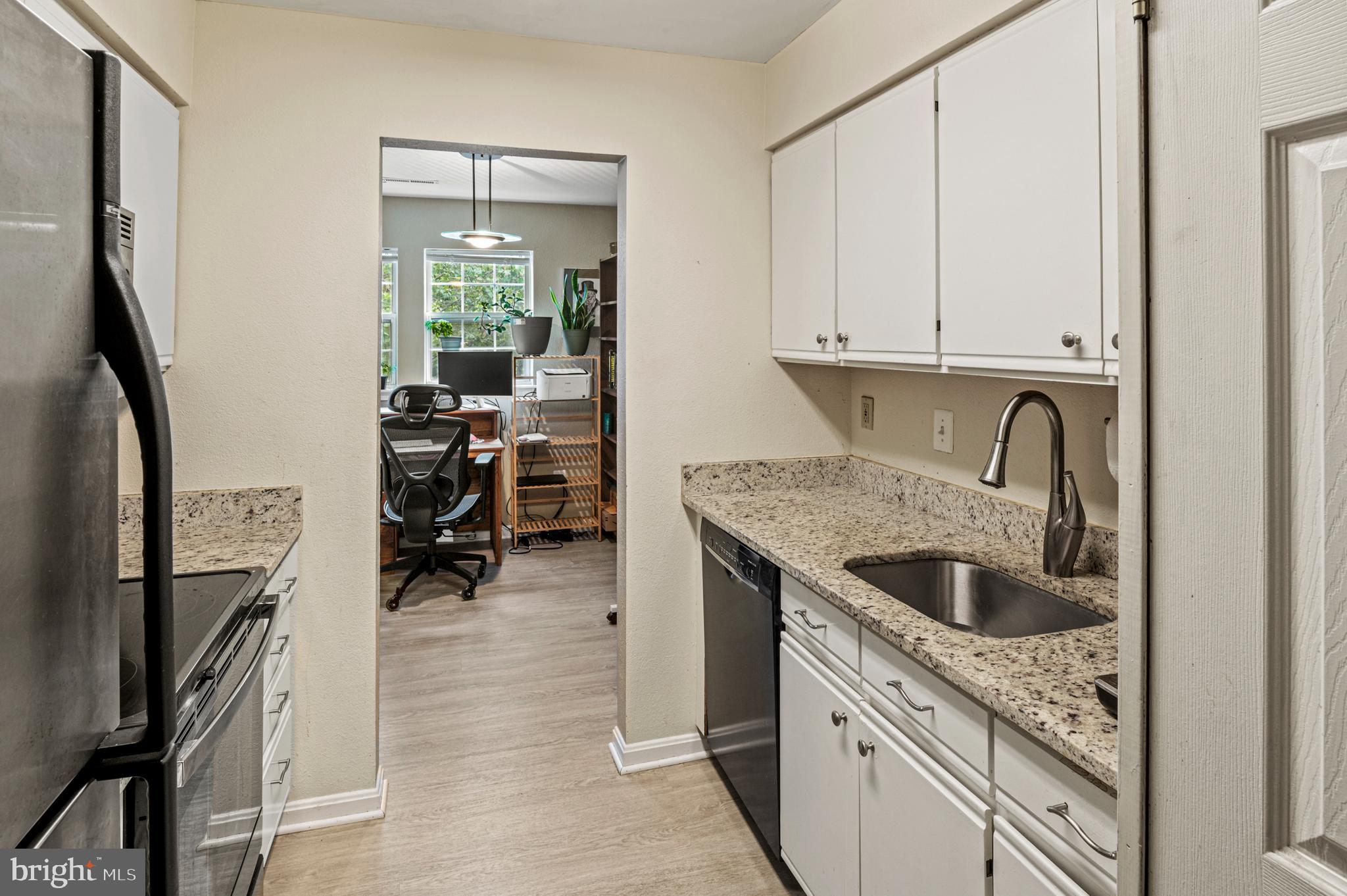 8559 Falls Run Road, Unit L Ellicott City, MD 21043 - Photo 6 of 28 a kitchen with a sink and cabinets