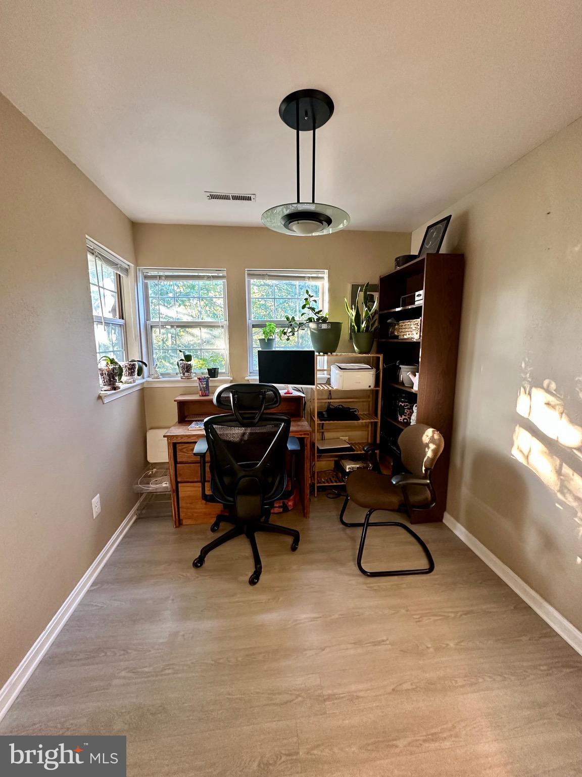 8559 Falls Run Road, Unit L Ellicott City, MD 21043 - Photo 8 of 28 a workspace with furniture hardwood and a window