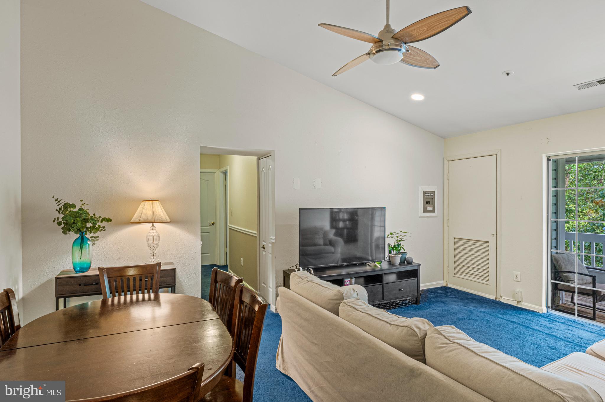 8559 Falls Run Road, Unit L Ellicott City, MD 21043 - Photo 10 of 28 a living room with furniture and a wooden floor