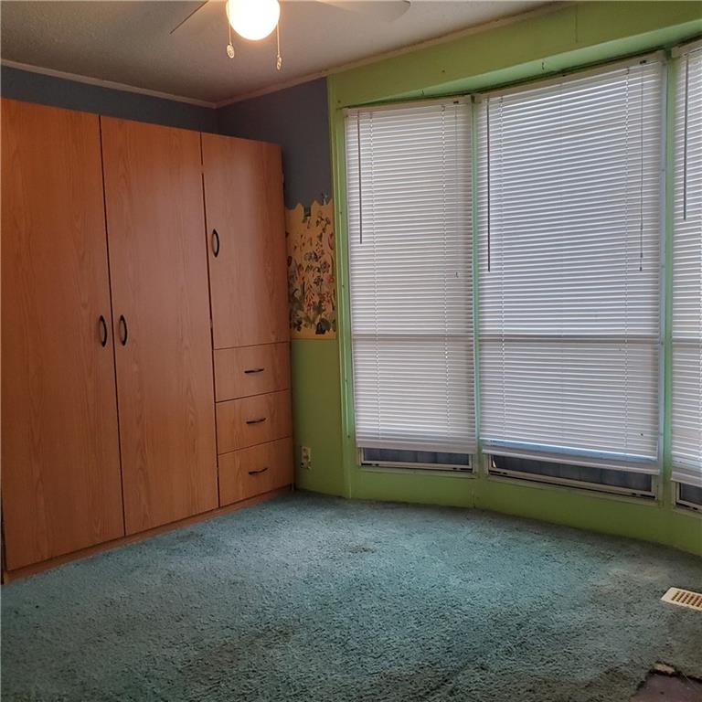 608 Amy Lane Butler, PA 16001 - Photo 12 of 18 an empty room with a window and a ceiling fan