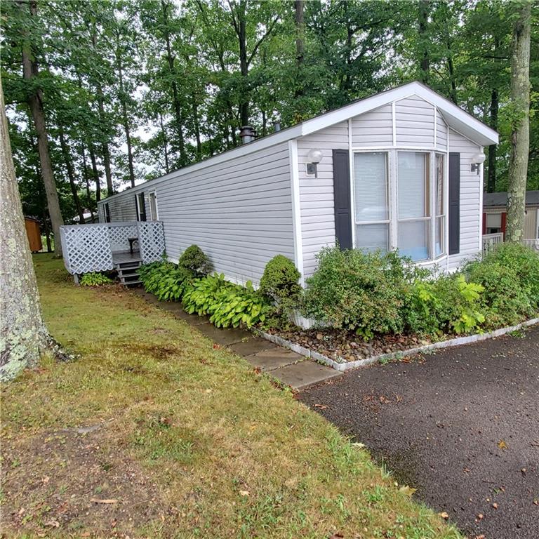 608 Amy Lane Butler, PA 16001 - Photo 2 of 18 a view of a wooden house with a yard and large trees
