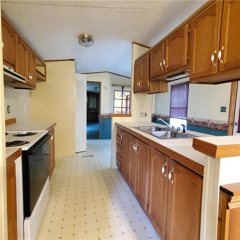 608 Amy Lane Butler, PA 16001 - Photo 5 of 18 a kitchen with stainless steel appliances granite countertop a sink stove and cabinets