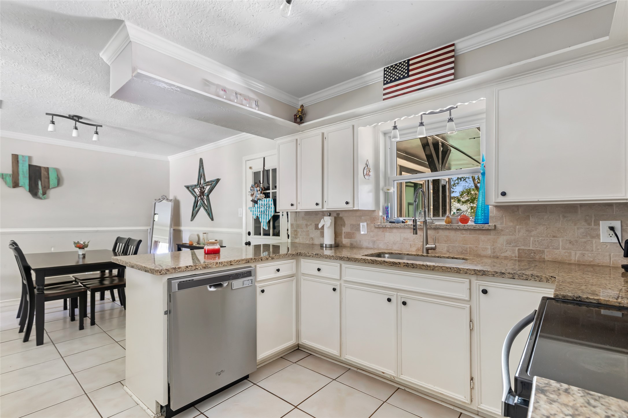 15816 Ramsey Road Crosby, TX 77532 - Photo 13 of 24 a kitchen with a sink stove and cabinets