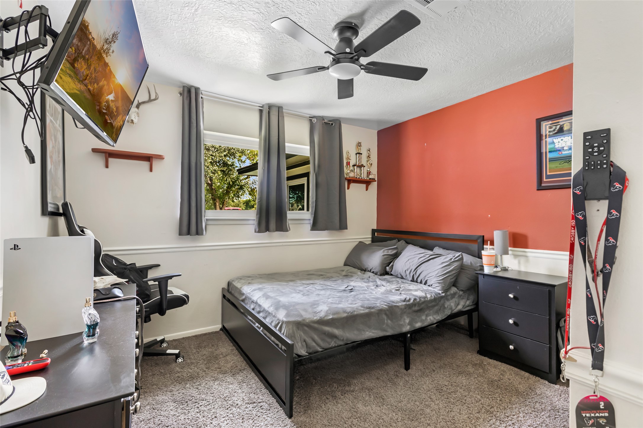 15816 Ramsey Road Crosby, TX 77532 - Photo 21 of 24 a bedroom with a bed and a chandelier