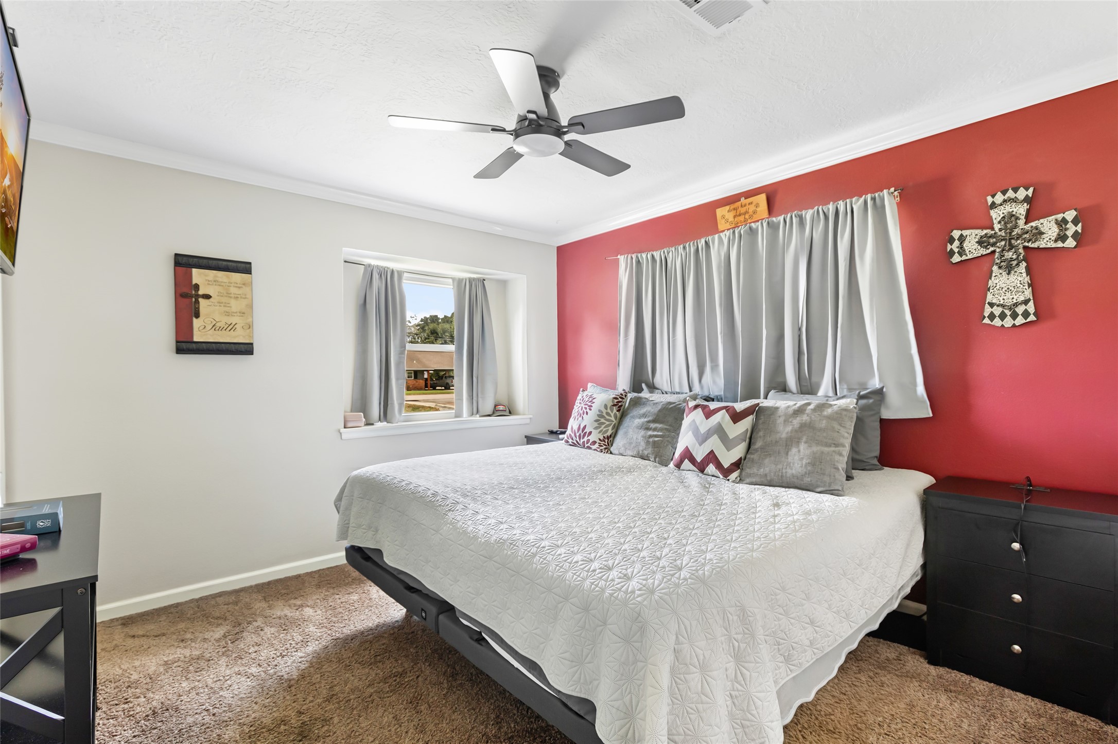 15816 Ramsey Road Crosby, TX 77532 - Photo 22 of 24 a bedroom with a bed and a chandelier