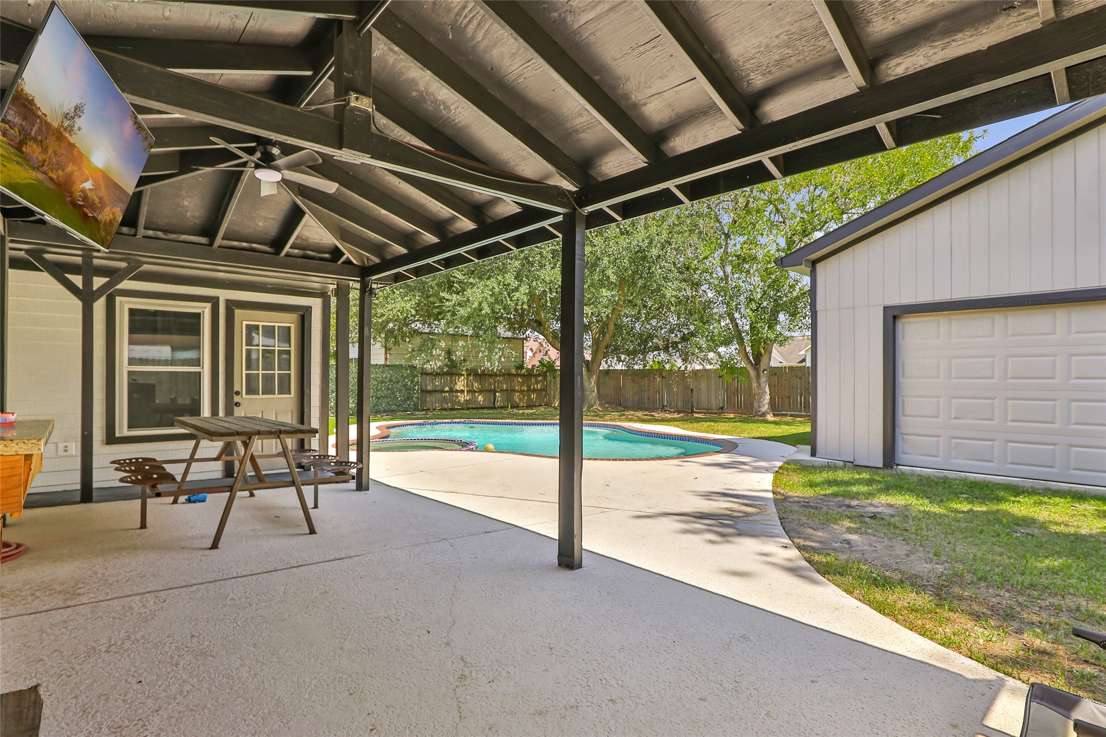 15816 Ramsey Road Crosby, TX 77532 - Photo 10 of 24 a view of a porch with chairs and backyard