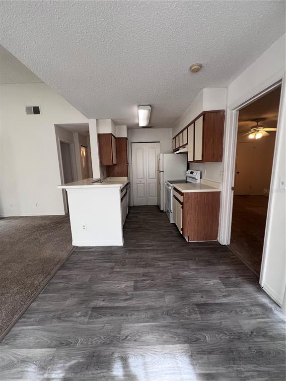 1061 South Hiawassee Road, Unit 1724 Orlando, FL 32835 - Photo 4 of 10 a living room with a furniture and a flat screen tv